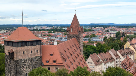 Cityscape with historic old town, traditional architecture, medieval rooftops, narrow streets of Nuremberg, Germany. Concept of tourism, documentaries, cultural content, European heritage.の写真素材