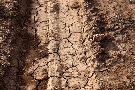 Dirt background with vehicle pattern trackの写真素材