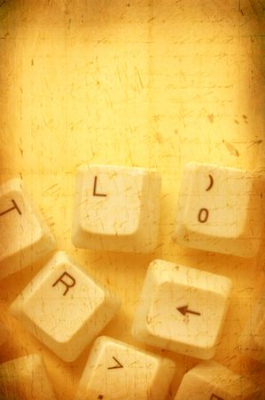 Close up of computer keys with old paper backgroundの写真素材