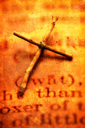 Close up of handmade paper tag with holy cross