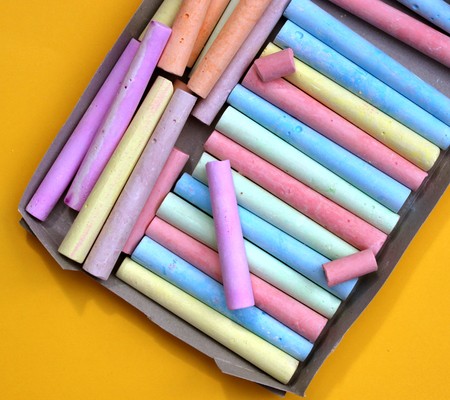Close up of color Chalks on paperの写真素材