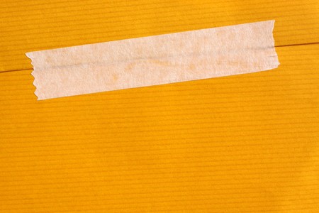 Close up of masking tape with paper の写真素材