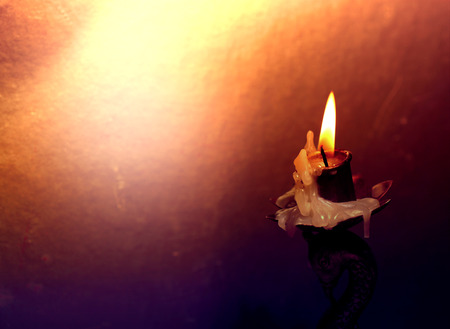 Close up of Candle with red backgroundの写真素材