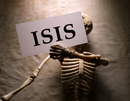Close up of skeleton holding ISIS label