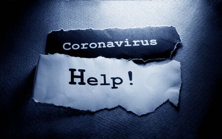 Close up of a COVID-19 text tag on paperの写真素材