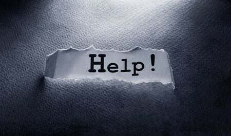 Close up of a COVID-19 text tag on paperの写真素材