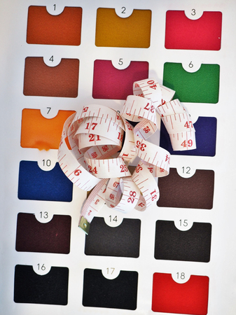 Measuring tape on colorful fabric catalogの写真素材
