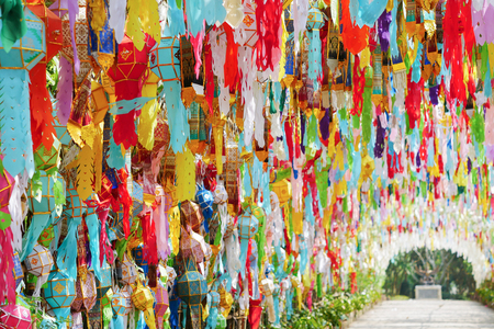 Colorful traditional Tung flag decorate the arch of walking path.の写真素材