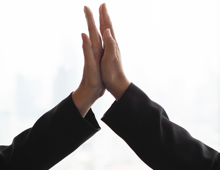 Two business hands high five.の写真素材