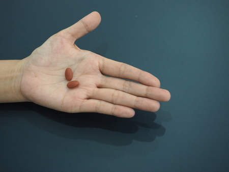 Two pills on hand.の写真素材