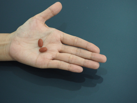 Two pills on hand.の写真素材