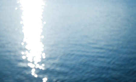 Blur sun light shining on water surface.の写真素材