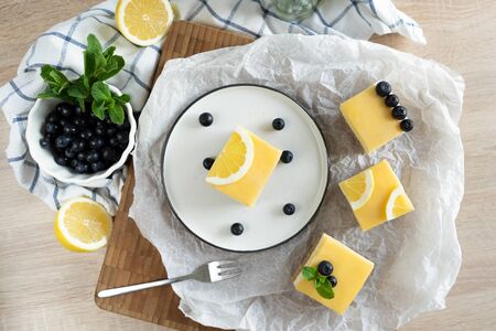 Cheesecake with lemon curd and blueberriesの写真素材