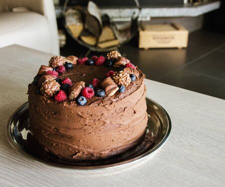Chocolate cake with raspberries and blueberriesの写真素材