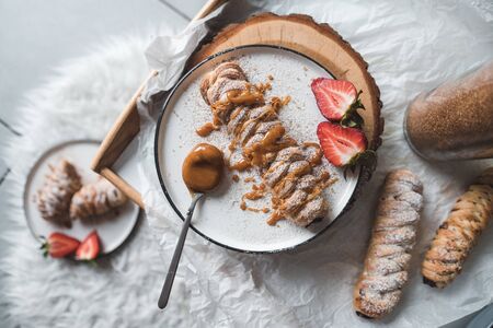 Walnut Plaits with Cinnamon and Caramel Sauceの写真素材