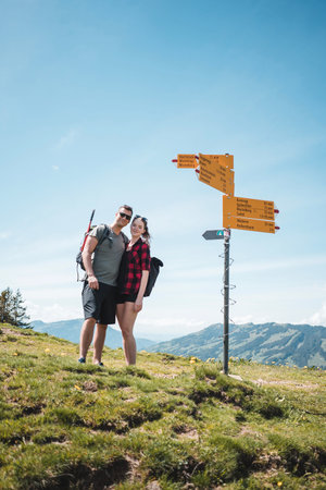 Young couple on a fork in the swiss mountains