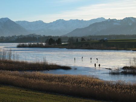 frozen lake and the Alps in Bavariaの写真素材