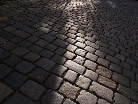 cobbled street with light and shadowsの写真素材