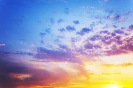 Cumulus clouds and summer sunset in the blue sky.の写真素材