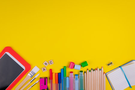 Set of school items on orange background. Back to school concept. Top view. Copy spaceの写真素材