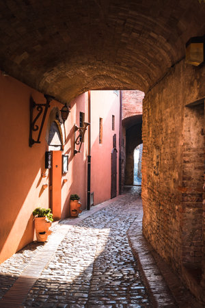 Ancient village of Certaldo in Tuscany, Italy during a summer morning, blue sky with clouds, architecture, alleys, Boccaccio, medievalのeditorial素材