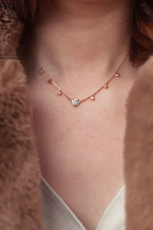 Uncanny woman silver necklace with gemstone close-up.の写真素材
