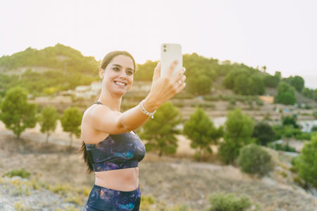 Young woman standing with her photo taken before she started running. Healthy living, running in the...