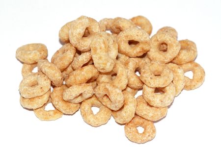 healthy snack - pile of cereals isolated on white backgroundの写真素材