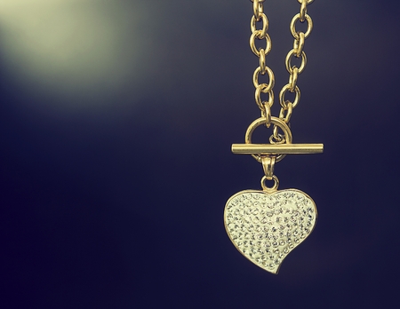 Gold necklace with a heart. Stainless steel. Gift of loveの写真素材