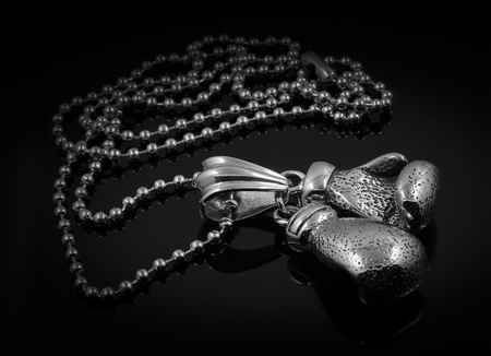 Pendant - Boxing gloves - Stainless Steel - Black backgroundの写真素材