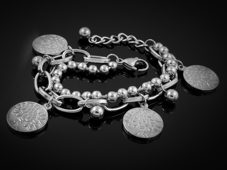 Ladies bracelet - Silver stainless steel - Black backgroundの写真素材