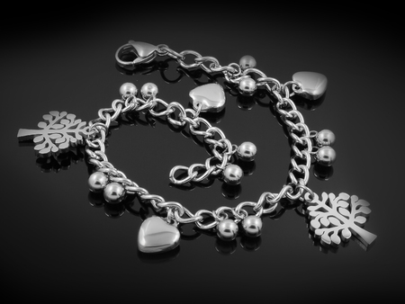 Ladies' silver bracelet with pendants - One color backgroundの写真素材
