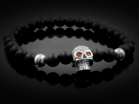 Bracelet with skull - Lava balls - One background colorの写真素材