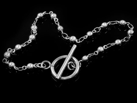 Jewelry silver bracelet. Stainless steel. One color background