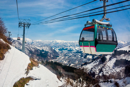 Stunning view from Ropeway in the mountains are covered with snow in winterの写真素材