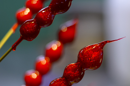 Closeup of strawberry candy.Traditional Chinese snack of candy fruit ,Tang Hulu or BingTanghulu Crispy Sugar-Coated Fruit on a Stick.の写真素材