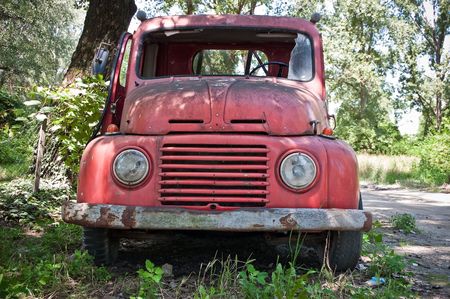 Red old timer truck in the forrestの写真素材