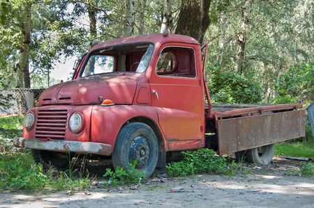 Red old timer truck in the forrestの写真素材