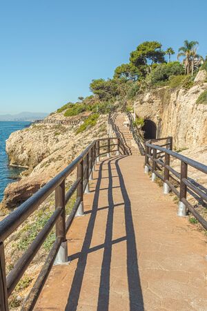 View of walking trail in "Cantal's Cliff" next to Mediterranean sea in "Cala of Moral". Malaga. Spain.の写真素材