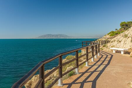View of walking trail in "Cantal's Cliff" next to Mediterranean sea in "Cala of Moral". Malaga. Spain.の写真素材