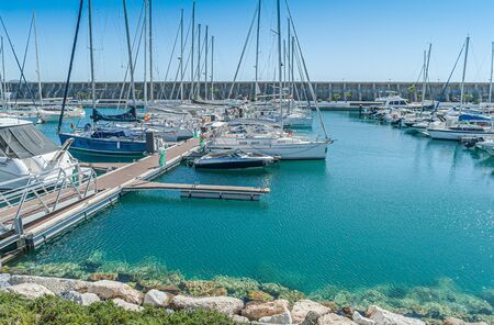 Boats parking in harbor at sunset. Port of Malaga. Costa del Sol. Spain.の写真素材