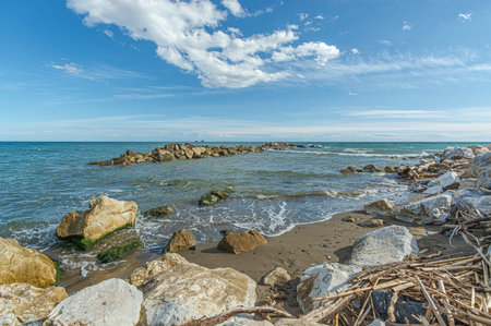 Coastal landscape Breakwater near to beach at Mediterranean Sea. Malaga. Spain.