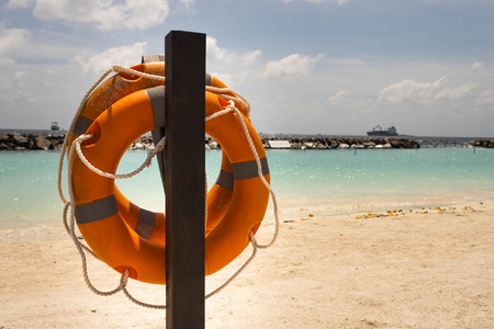 Lifebuoy on a sea background - beach seasonの写真素材