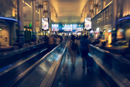 International airport with unrecognizable peopleの写真素材