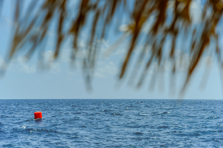 Red buoy Navigation or lateral Marks floating in the seaの写真素材