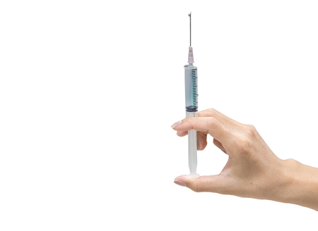 Syringe,medical injection in hand ,liquid drug or narcotic,Medicine plastic vaccination equipment with needle on white backgoundの写真素材