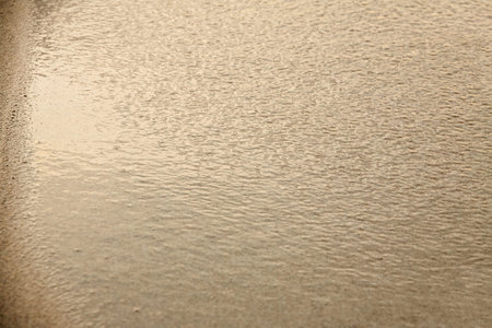 Wet sand in the evening sun