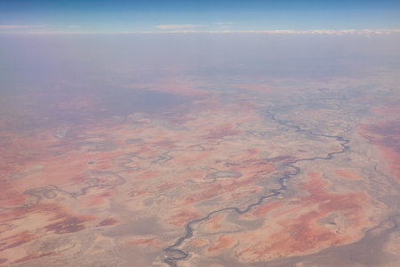 Aerial shots over the Australian outback and its red structures of the continentの写真素材