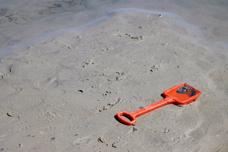 Toys in the sand on the beach, closeup of photoの写真素材