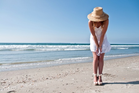 Looking for shells at the beachの写真素材